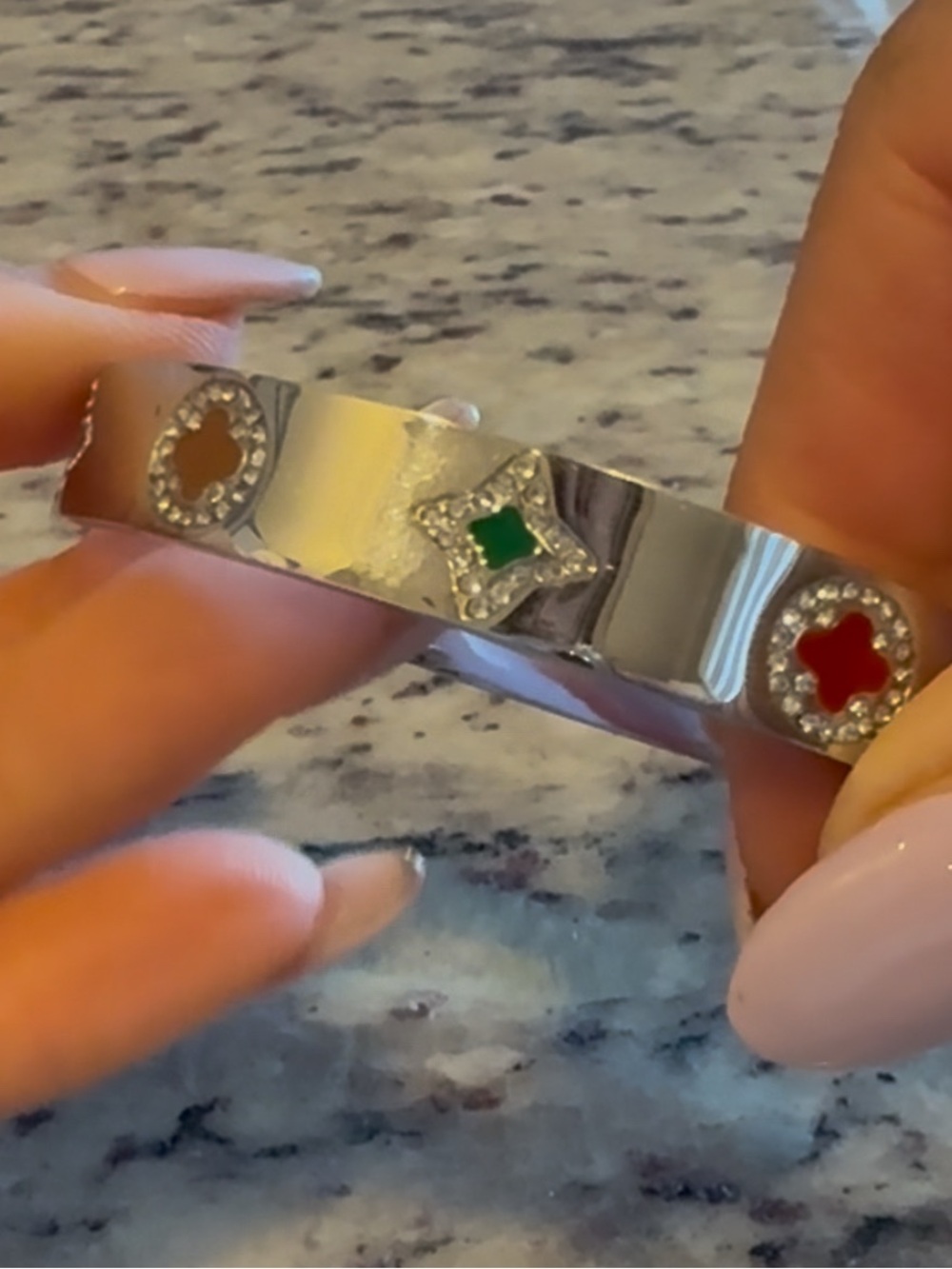 This is a stainless steel, silver-toned bangle bracelet